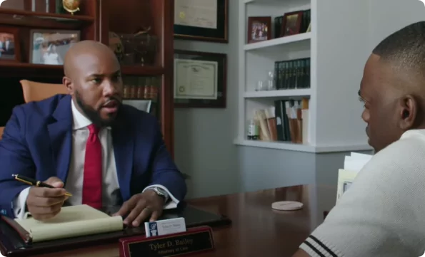 attorney tyler bailey speaking with client